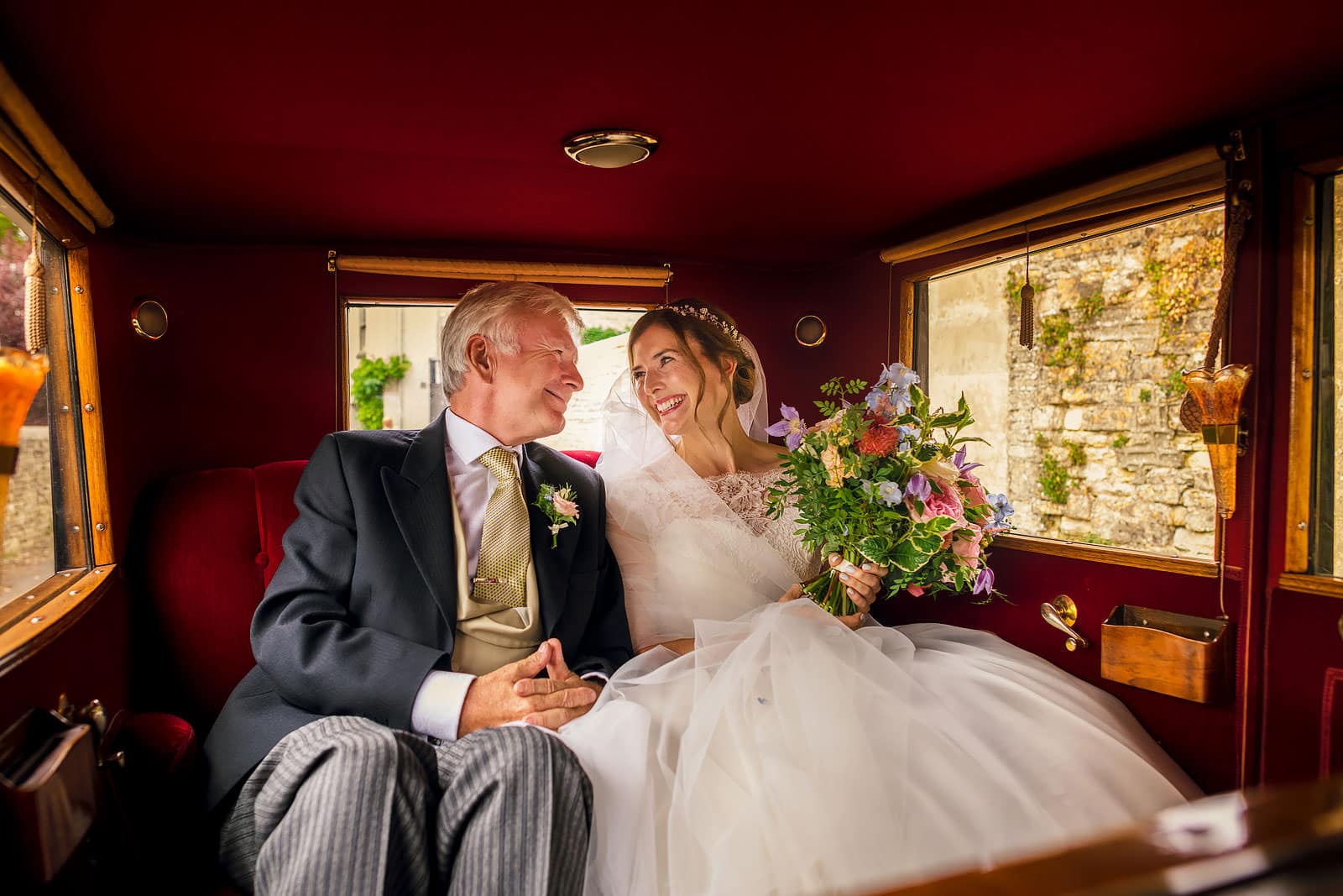 A very proud father of the bride seeing his daughter in her wedding dress in The Cotswolds